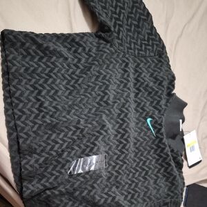 Nike Men's Black and Teal Patterned Bomber Jacket